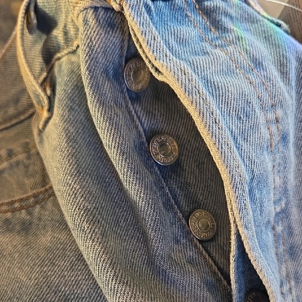 Levi's 501 Light Blue Distressed Jean Shorts‎